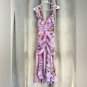 Lavender floral dress with cutouts on waist; ruching and an asymmetrical hem.